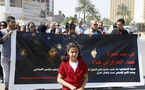 Protesters take part in a demonstration against the draft of the "Al-Jafaari" Personal Status Law during International Women's Day in Baghdad