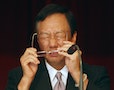 郭台銘 Terry Gou, founder of Taiwan's Hon Hai Precision Industry company, the mother company of Foxconn, adjusts his glasses during a shareholder conference in Tucheng