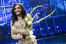Conchita Wurst representing Austria poses with the trophy after winning the 59th annual Eurovision Song Contest in Copenhagen