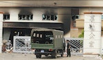 A riot police officer stands guard outside the damaged Shining company building in Vietnam's southern Binh Duong province