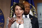 Democratic House leader Pelosi speaks about Benghazi as Rep. Cummings  listens during a press conference in the Capitol in Washington