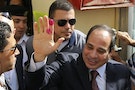 Presidential candidate and former army chief Sisi gestures after casting ballot in Cairo