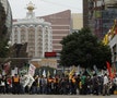 Protesters march in front of casinos in Macau