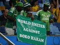 Nigerian fans hold a banner against Boko Haram during their 2014 World Cup Group F soccer match agaisnt Bosnia at the Pantanal arena in Cuiaba