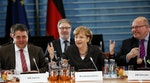 German Chancellor Merkel, Economy Minister Gabriel and chief of staff Altmaier talk at the Chancellery in Berlin