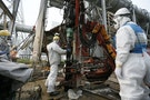 Workers conduct operations to construct an underground ice wall at Tepco's tsunami-crippled Fukushima Daiichi nuclear power plant