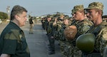 Ukrainian President Poroshenko meets with Ukrainian servicemen during his visit to the coastal town of Mariupol
