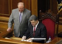 Ukraine's President Petro Poroshenko signs a landmark association agreement with the European Union during a session of the parliament in Kiev