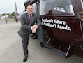 First Minister of Scotland Alex Salmond poses before boarding a flight in his campaign helicopter in Aberdeen