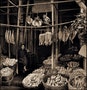 Seated Man Amid Baskets Of Fish & Hanging Dried Fish, Eastern Districts, Hong Kong Island