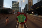 A sign is displayed by pro-democracy protesters on a vehicle bridge during the Occupy Central civil disobedience movement at the Central financial district in Hong Kong