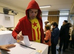 Man casts his ballot in a symbolic independence vote in Barcelona