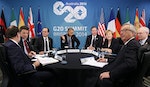 U.S. President Obama gestures as he meets with European leaders at the G20 in Brisbane