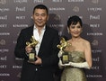 Chen Jianbin and Chen Shiang-chyi pose with their awards at the Golden Horse Film Awards in Taipei