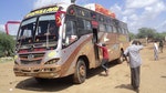 Rescue workers walk near a Nairobi-bound bus that was ambushed outside Mandera town