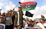 2013年5月，利比亞示威民眾焚燒卡達國王塔敏(Tamim)的芻像，抗議卡達及穆兄會(Muslim Brotherhood)介入利比亞內政。Photo Credit: Reuters/達志影像