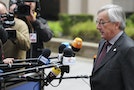 Luxembourg's PM Juncker talks to the media as he arrives at a European Union leaders summit in Brussels