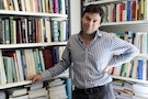 French economist Thomas Piketty poses in his office in Paris