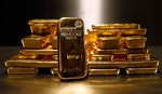 Gold bars are stacked in safe deposit boxes room of the ProAurum gold house in Munich
