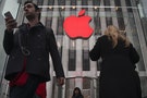 The Apple logo is illuminated in red at the Apple Store on 5th Avenue to mark World AIDS Day, in the Manhattan borough of New York
