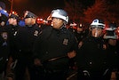 Police in protective gear form a line as they respond to protesters on the West Side Highway in Manhattan in New York City as thousands of demonstrators took to the streets of New York demanding justi