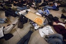 A pizza is seen in the center of a "Die-In" during a small march at Grand Central Station for chokehold death victim Eric Garner in New York