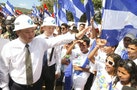 HKND Group Chairman Wang Jing greets youths during the start of the first works of the Interoceanic Grand Canal in Brito town