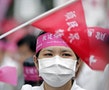 A medical worker waves a flag during a protest in Taipei.