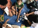 CAMBODIAN STREET BOY RECEIVES MEDICAL TREATMENT