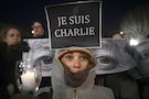 People take part in a vigil to pay tribute to the victims of a shooting, by gunmen at the offices of weekly satirical magazine Charlie Hebdo in Paris, in the Manhattan borough of New York