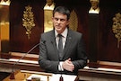 Prime Minister Manuel Valls delivers a speech during a session at the National Assembly in Paris to pay respects to the victims of last week's attacks by Islamist militants