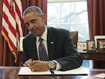 United States President Obama signs a Presidential Memorandum on paid leave for federal employees in the Oval Office of the White House in Washington