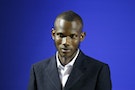Lassana Bathily, 24, poses during a ceremony to receive his citizenship papers at the Interior Ministry in Paris