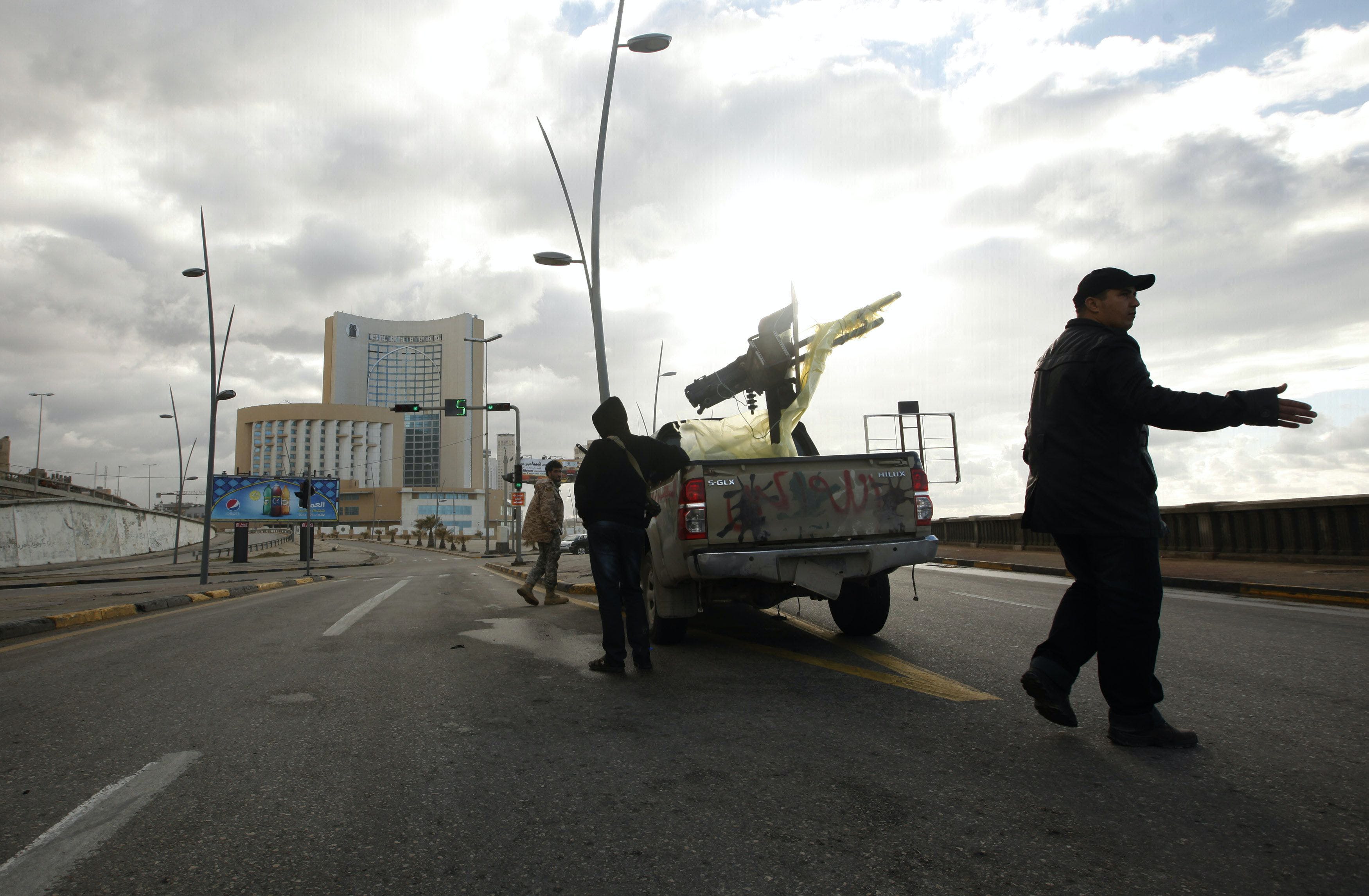 A vehicle belonging to security forces is pictured near Corinthia hotel in Tripoli