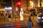 Lahcen waits to cross a street in Paris