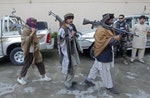 Members of the Taliban voluntarily hand over their weapons and join a peace reconciliation program in Jalalabad province