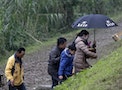 Family members of the passengers on the crashed TransAsia Airways plane Flight GE235 leave the site after a Daoist ceremony in New Taipei City