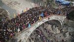People crowd onto a bridge during the annual Caiqiaohui event in Mianyang