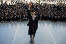 A Japanese college graduate publicly promises that she will do her best in trying to find work during a job-hunting rally at an outdoor theatre in Tokyo