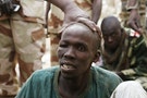 A man, whom Chadian military say they have taken prisoner for belonging to insurgent group Boko Haram, is seen in Gambaru
