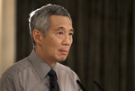 Singapore's Prime Minister Lee Hsien Loong addresses the nation after the passing of his father former prime minister Lee Kuan Yew at the Istana in Singapore