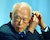 李光耀 SINGAPORE'S SENIOR MINISTER LEE USES EARPHONE BEFORE DISCUSSIONS ATINTERNATIONAL CONFERENCE IN TOKYO.