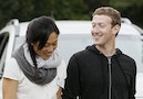 Facebook CEO Zuckerberg walks with his wife Priscilla Chan at the annual Allen and Co. conference at the Sun Valley