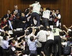 Opposition DPP legislators scuffle with ruling KMT legislators at the Legislative Yuan in Taiwan