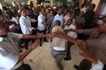 Members of the Somali parliament fight after majority voted against the Speaker of the Parliament Sharif Hassan Sheikh Aden in southern Mogadishu
