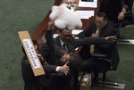 Pro-democracy lawmaker Leung throws a cushion at Hong Kong's Financial Secretary John Tsang during the annual budget report at the Legislative Council in Hong Kong