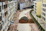 A "nail house", the last building in the area, sits in the middle of a road under construction in Nanning