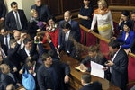 Opposition deputies throw buckwheat at newly elected deputy Pylypyshyn as he takes the oath in Ukrainian Parliament in Kiev