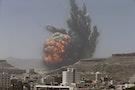 Smoke rises during an air strike on an army weapons depot on a mountain overlooking Yemen's capital Sanaa