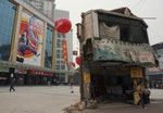 A "nail house", the last house in this area, stands on the square in front of a shopping mall in Changsha